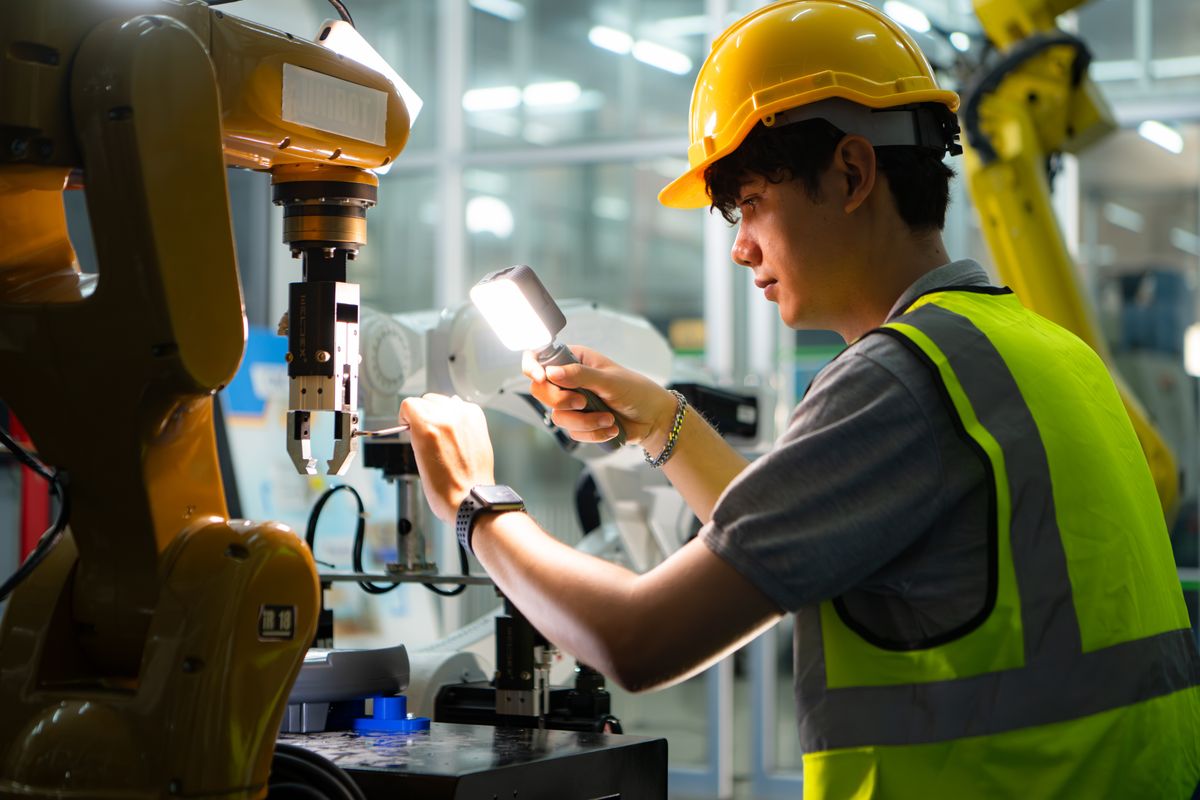 Technician,Who,Maintains,A,Small,Robot,Arm,The,Operation,Of