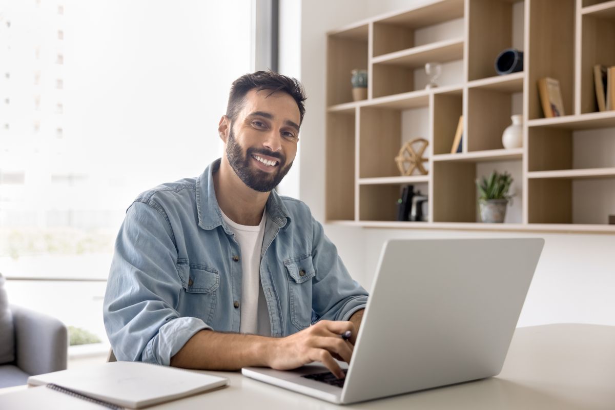 Happy,Handsome,Latin,Entrepreneur,Man,Typing,On,Laptop,At,Office